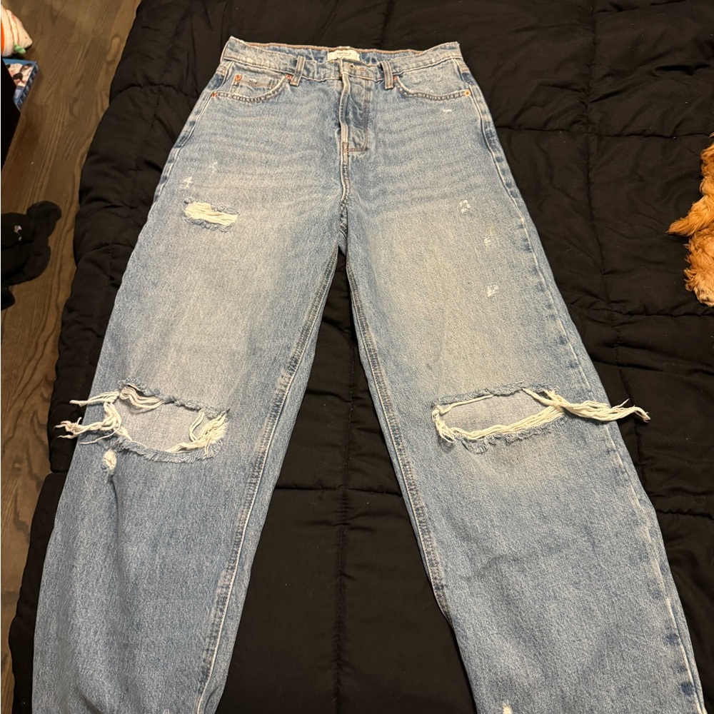 High-waisted, straight-leg, distressed denim jeans with a relaxed fit